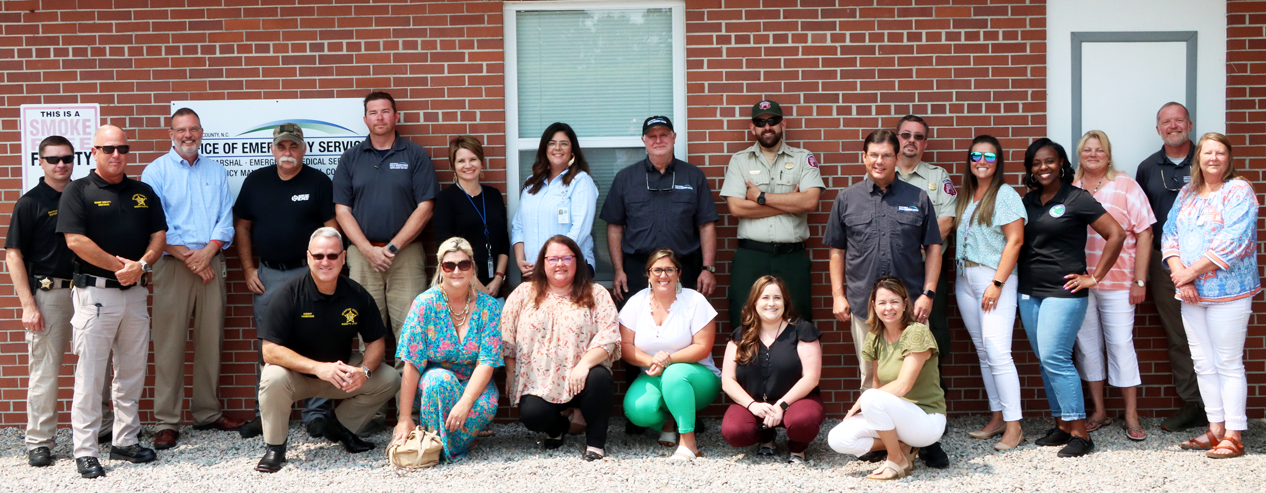 County employees standing with Carnie Hedgepeth